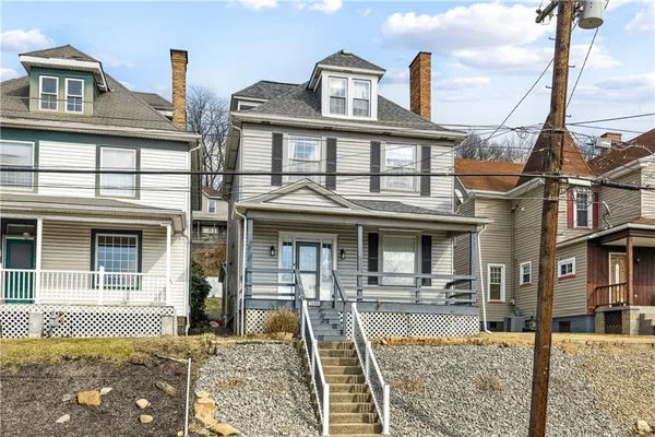 a front view of a house with swimming pool