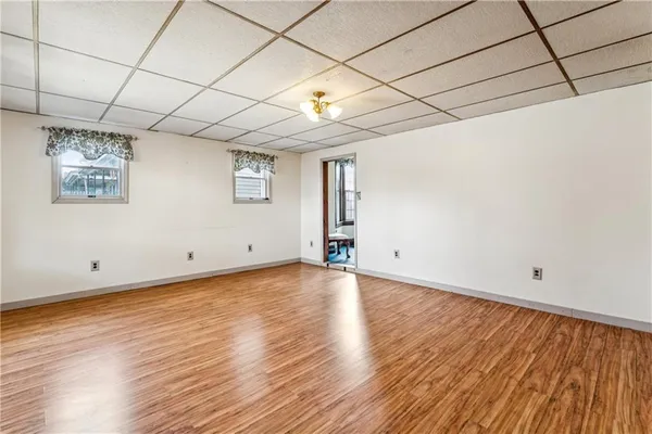 a view of a livingroom with a window and a ceiling fan