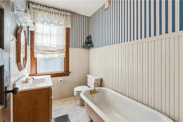 a picture of a bathroom with a shower