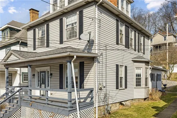 a front view of a house with a porch