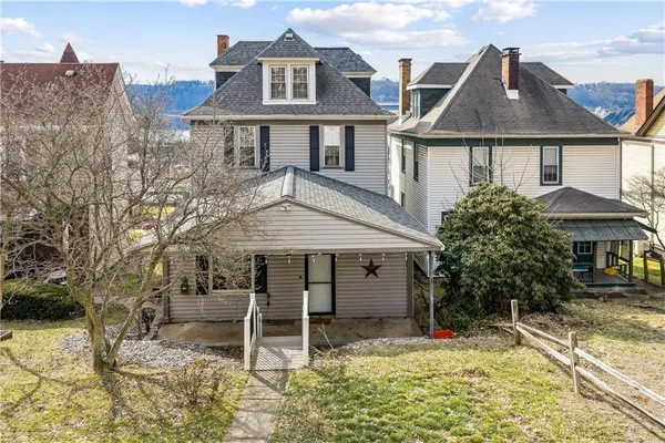 a house with trees in front of it