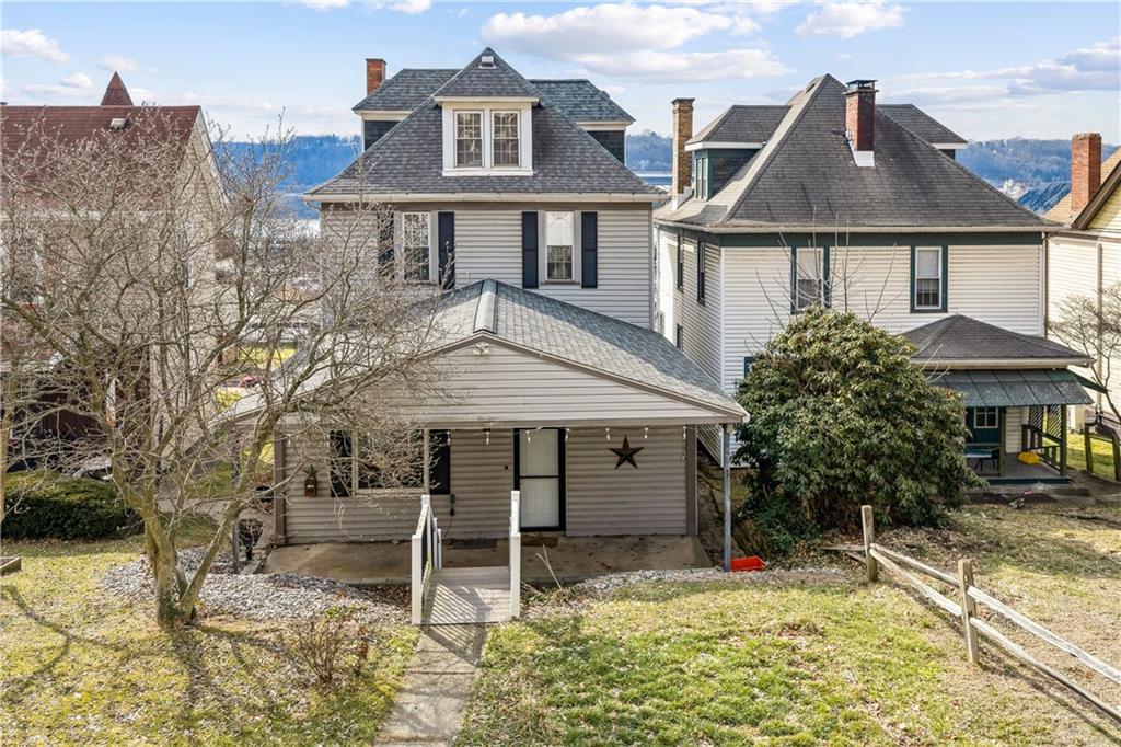 1369 5th Avenue Freedom, PA 15042 - Photo 6 of 41 a house with trees in front of it