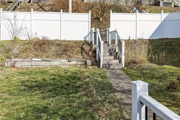 a view of a yard with an ocean view