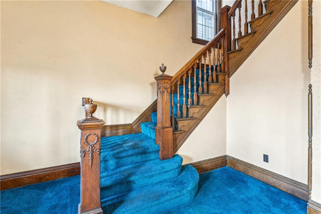 1369 5th Avenue Freedom, PA 15042 - Photo 10 of 41 a view of staircase with wooden floor and white walls