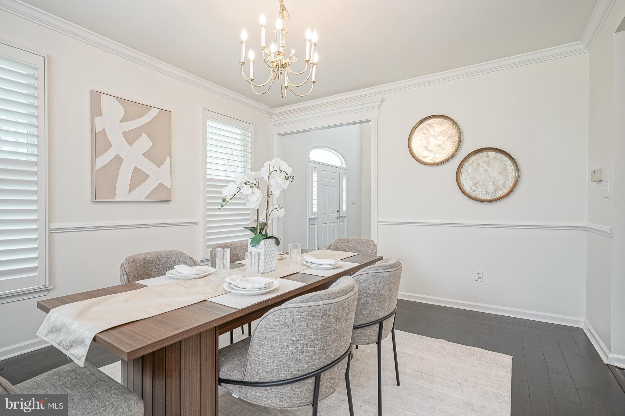 6101 Church Road Mount Laurel, NJ 08054 - Photo 11 of 64 a dining room with wooden floor a chandelier a wooden table and chairs