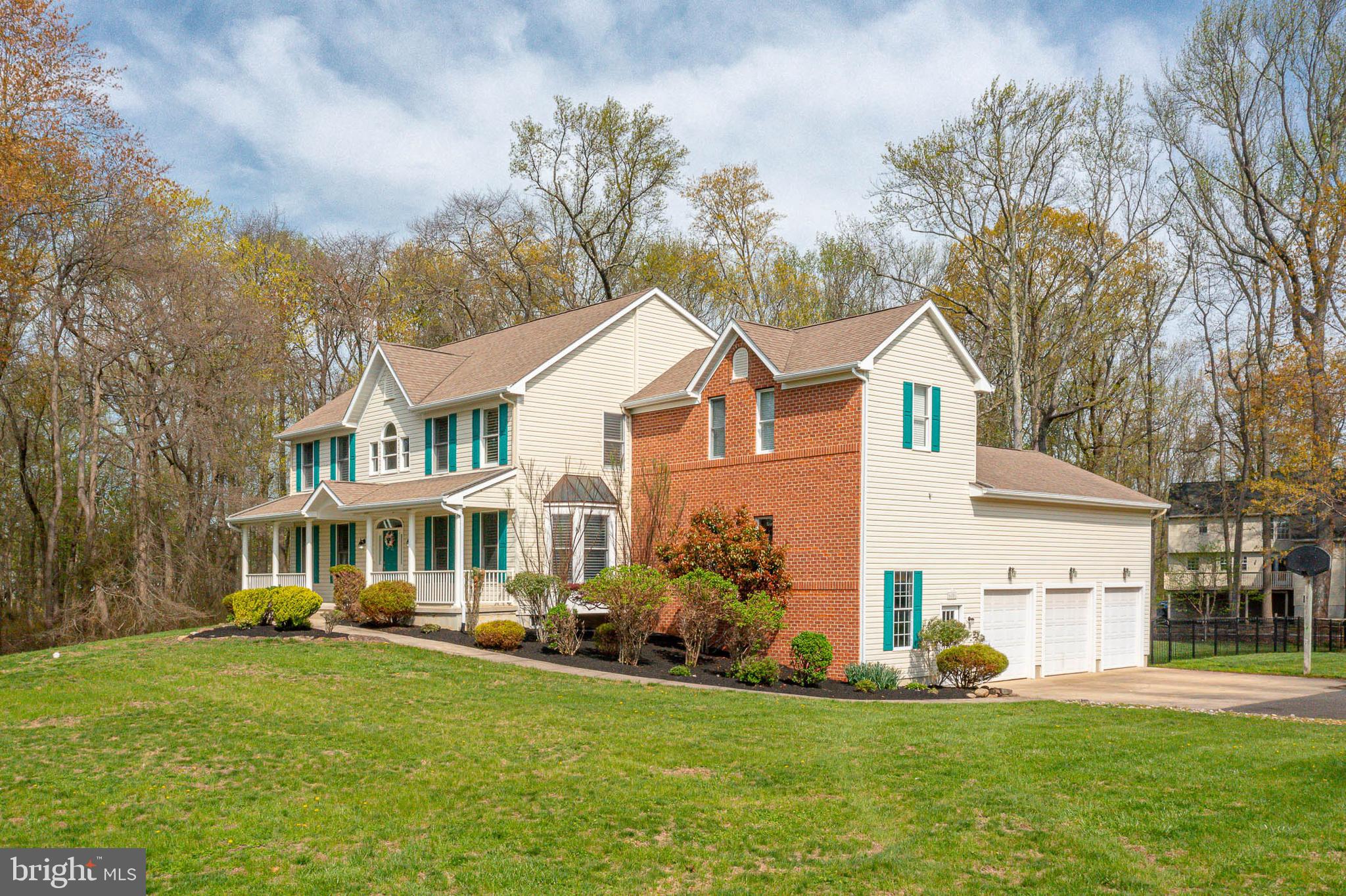 6101 Church Road Mount Laurel, NJ 08054 - Photo 2 of 64 a front view of a house with a yard and trees