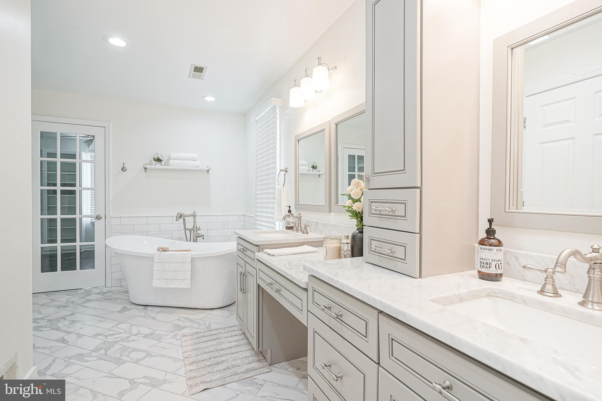 6101 Church Road Mount Laurel, NJ 08054 - Photo 28 of 64 a bathroom with a granite countertop double vanity sink a mirror and a bathtub