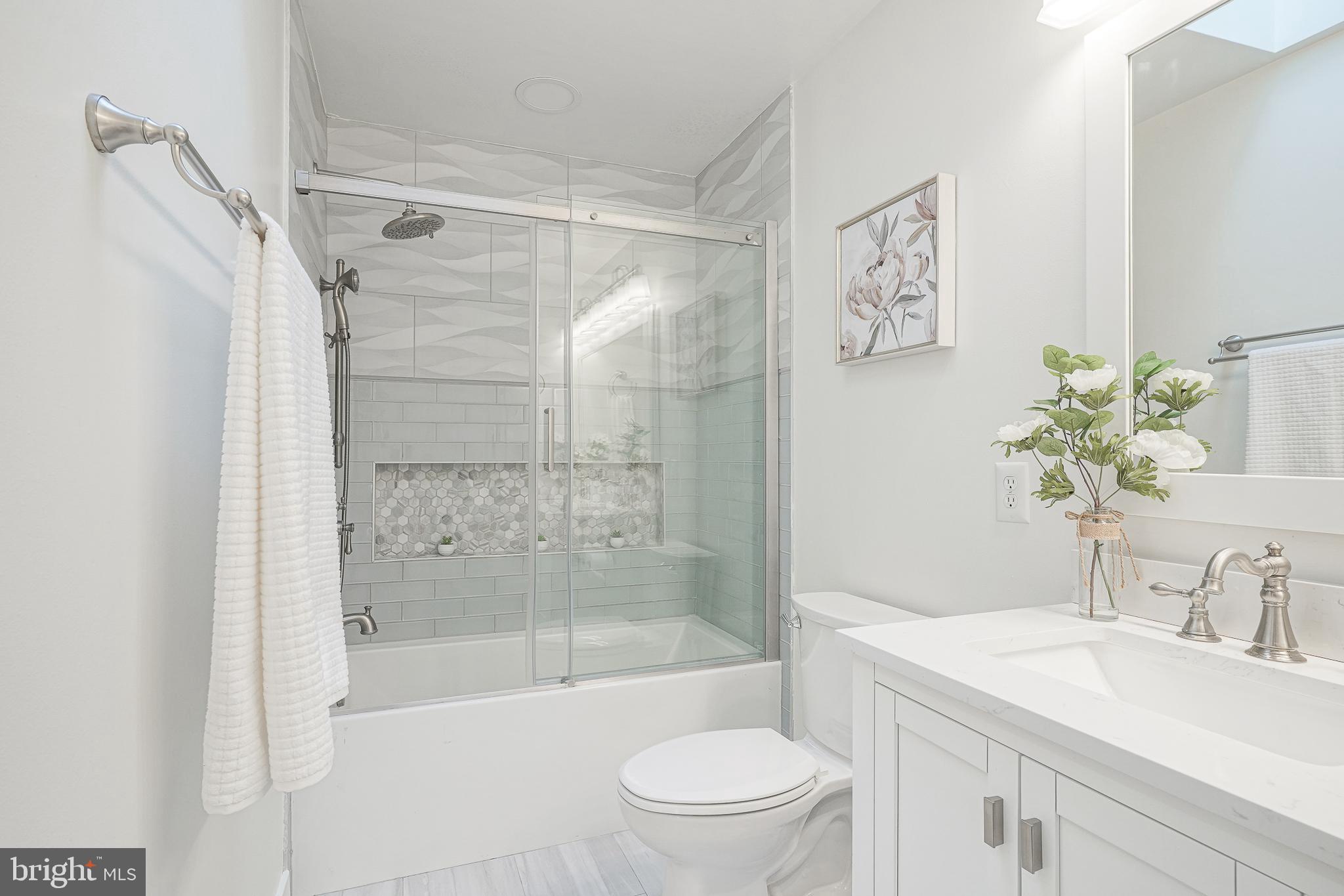 6101 Church Road Mount Laurel, NJ 08054 - Photo 42 of 64 a bathroom with a sink a toilet and a large mirror