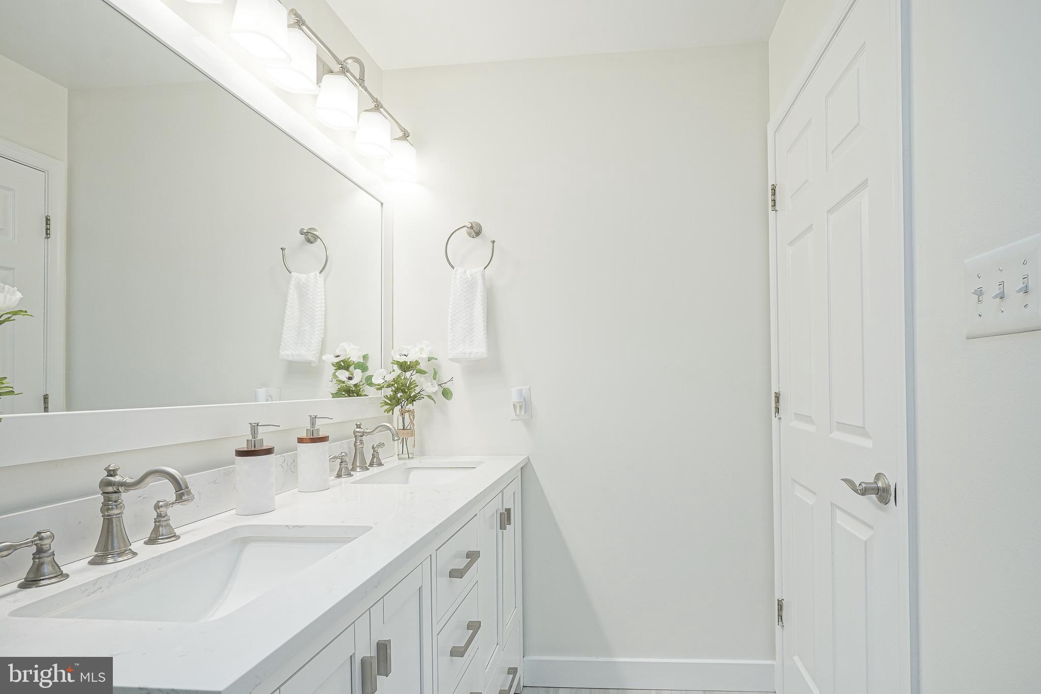6101 Church Road Mount Laurel, NJ 08054 - Photo 43 of 64 a bathroom with double vanity sink and a mirror