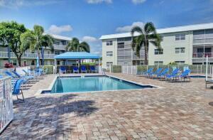 9880 Marina Boulevard, Unit 1509 Boca Raton, FL 33428 - Photo 2 of 43 a view of a house with swimming pool and sitting area