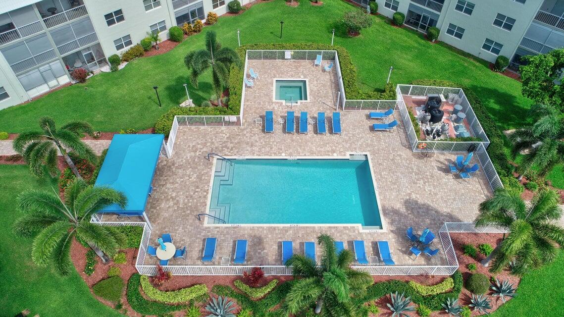 9880 Marina Boulevard, Unit 1509 Boca Raton, FL 33428 - Photo 28 of 43 an aerial view of a house with garden space and swimming pool