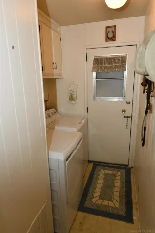 a bathroom with a sink and a washing machine