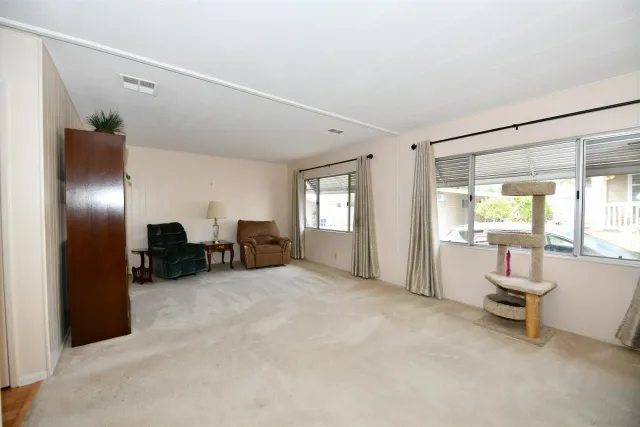 a view of a livingroom with furniture and a livingroom