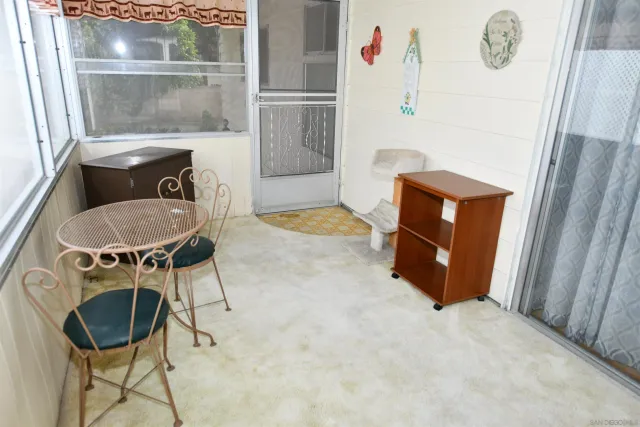 a room with table and chairs