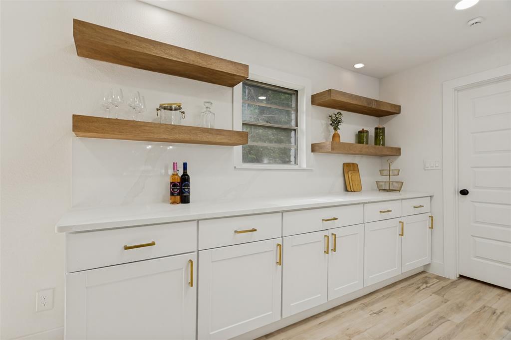 3816 Springbranch Drive Benbrook, TX 76116 - Photo 12 of 25 a kitchen with white cabinets and sink