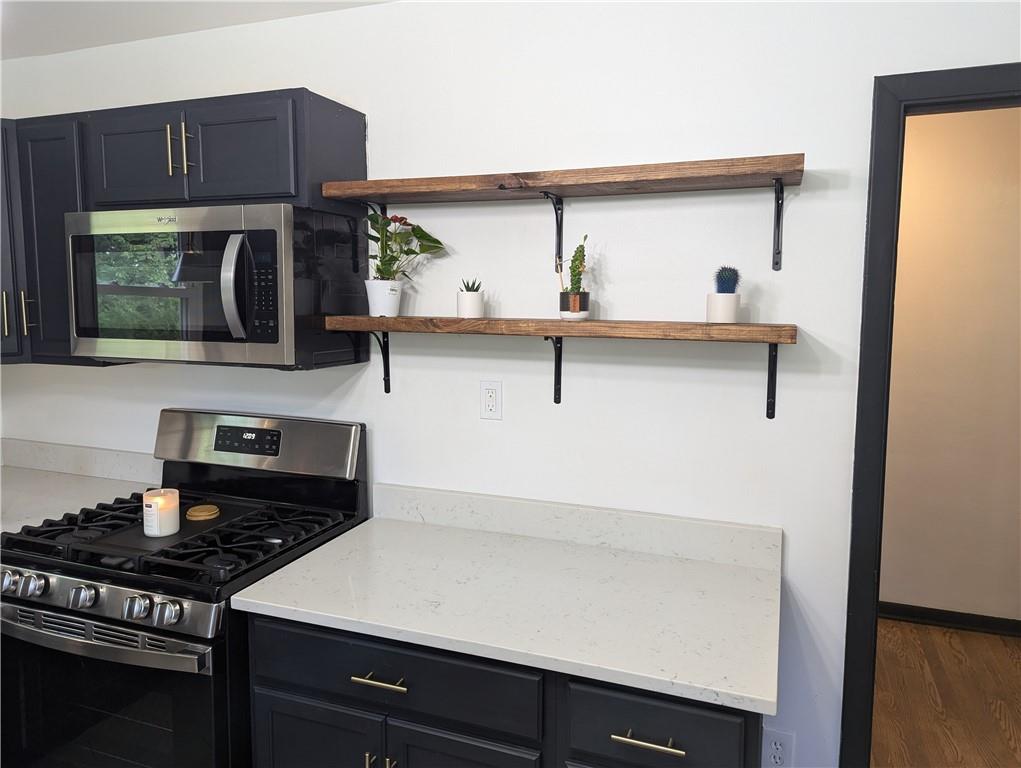 146 Ridgewood Road Coraopolis, PA 15108 - Photo 13 of 31 a kitchen with a cabinets and stove