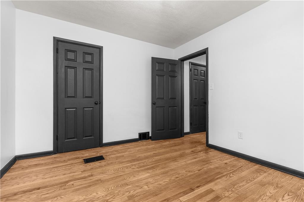 146 Ridgewood Road Coraopolis, PA 15108 - Photo 20 of 31 a view of an empty room with wooden floor