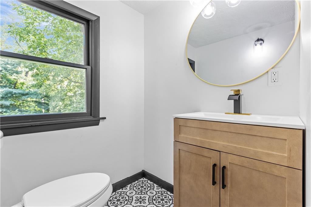 146 Ridgewood Road Coraopolis, PA 15108 - Photo 21 of 31 a bathroom with a sink a toilet and a mirror