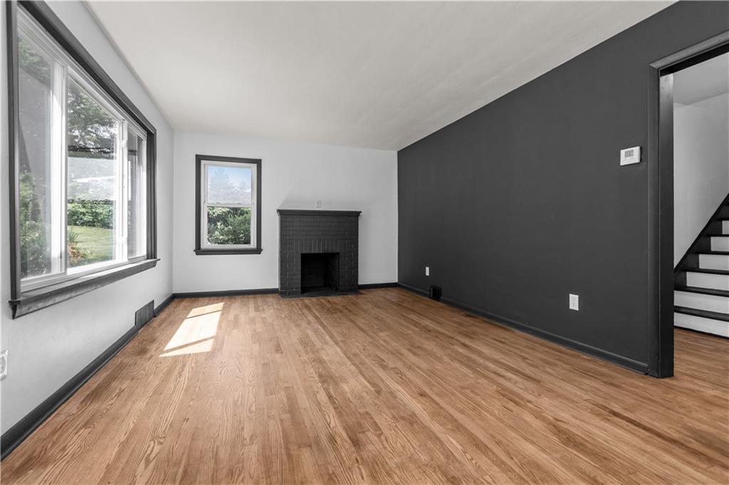146 Ridgewood Road Coraopolis, PA 15108 - Photo 7 of 31 a view of empty room with wooden floor and fan