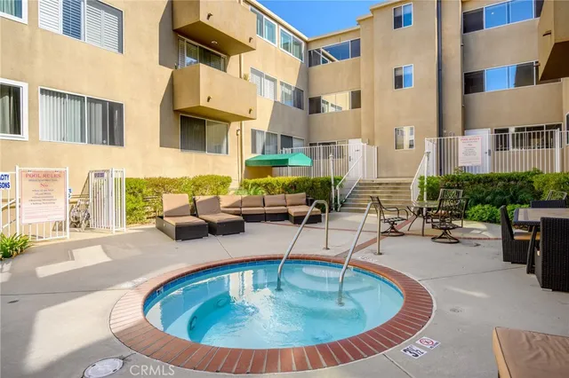 a living room with furniture and flowers