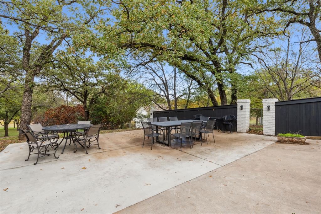 7342 Briar Road Azle, TX 76020 - Photo 31 of 40 BBQ side yard patio next to tier garden
