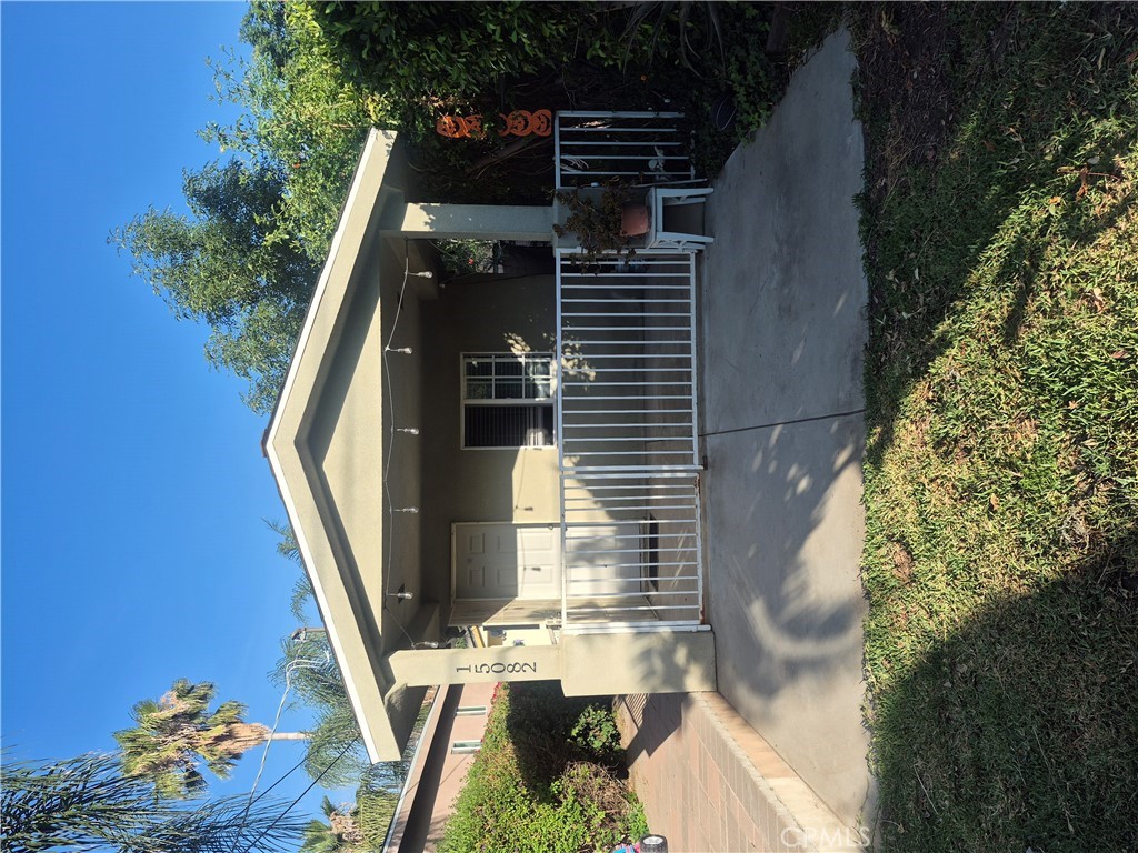 15080-15082 Roxford Street Sylmar, CA 91342 - Photo 2 of 8 Front House Sun Setting