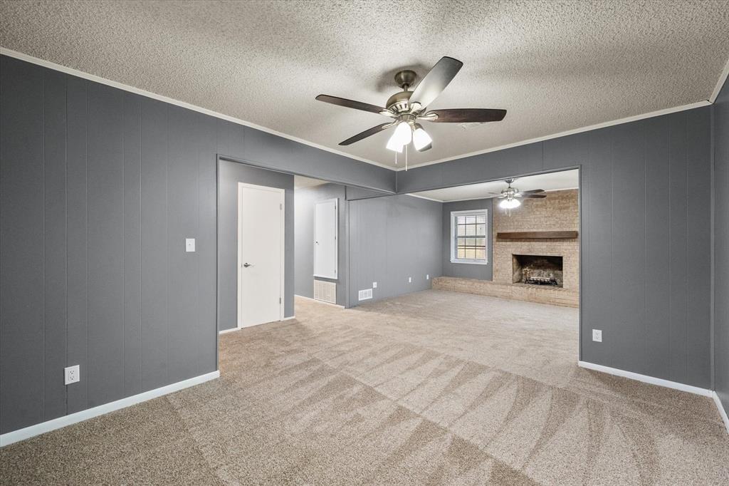 536 Robindale Lane Fairfield, TX 75840 - Photo 7 of 38 a view of an empty room with chandelier fan and windows
