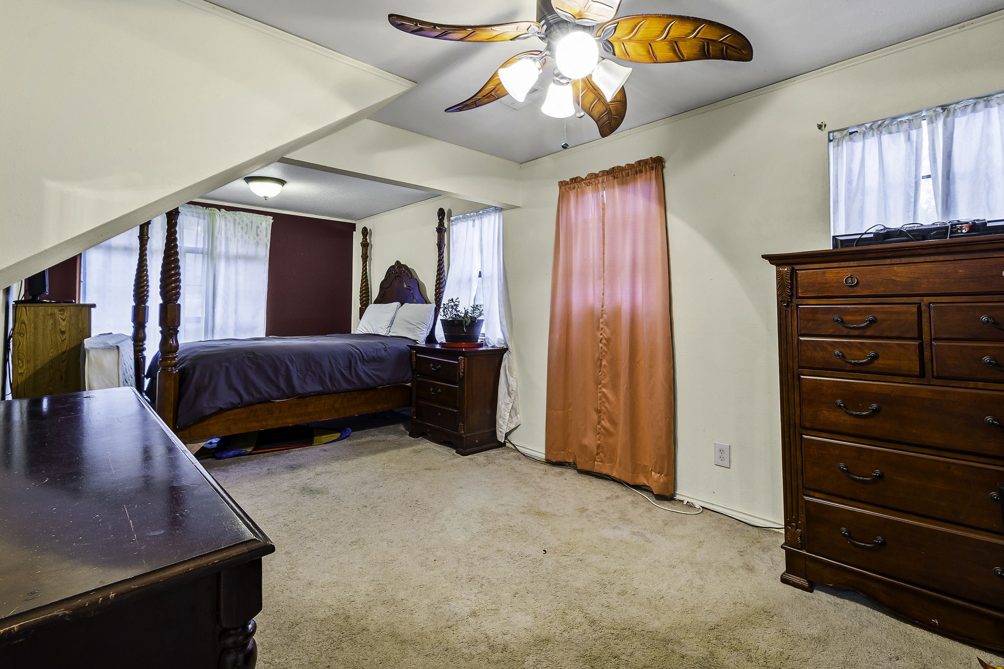 389 Vanderbilt Livingston, TX 77351 - Photo 9 of 25 a bedroom with furniture and a chandelier