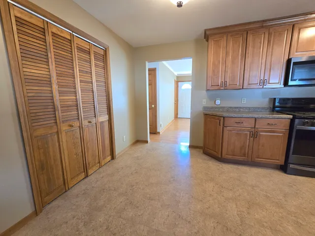 a view of a kitchen with electric appliances
