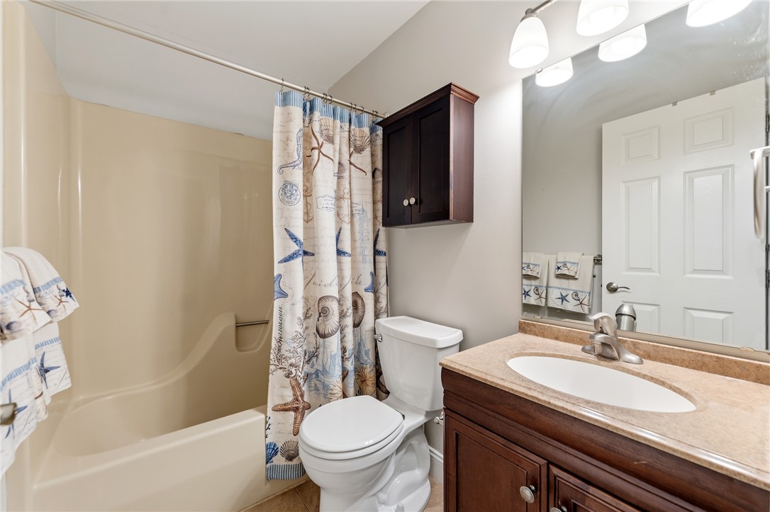1014 East Queen Street Pendleton, SC 29670 - Photo 29 of 43 A well-appointed bathroom features a bathtub, toilet, and a vanity with a large mirror.