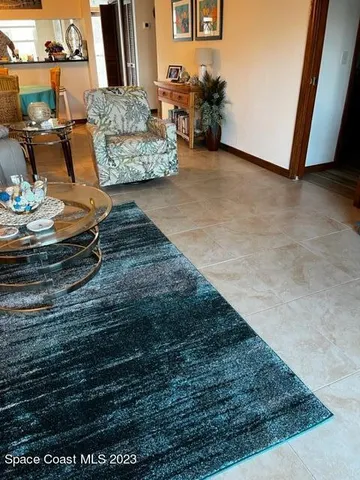 a living room with furniture and a rug