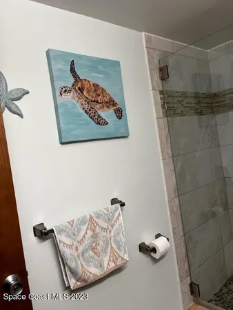 a bathroom with a bathtub and shower