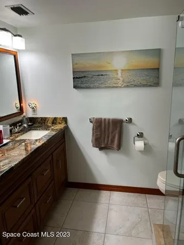 a kitchen with stainless steel appliances granite countertop a sink and a stove