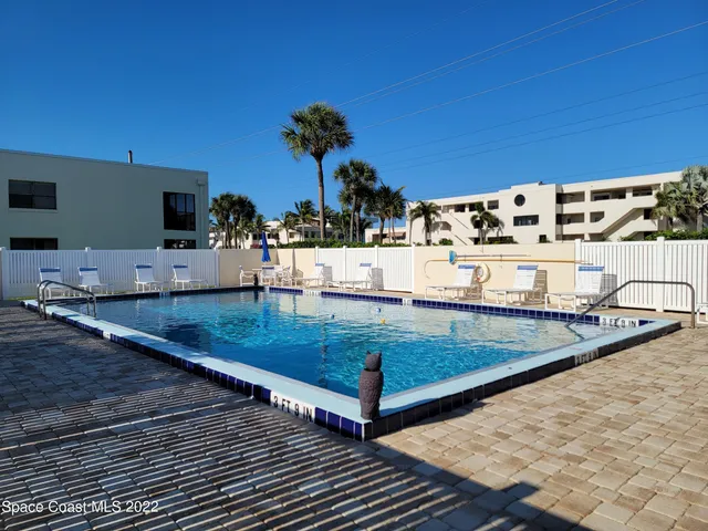 a view of a living room and dining room