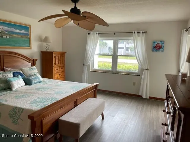 a bed room with a bed and window