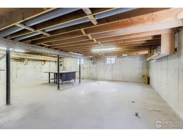 a view of empty room with wooden ceiling
