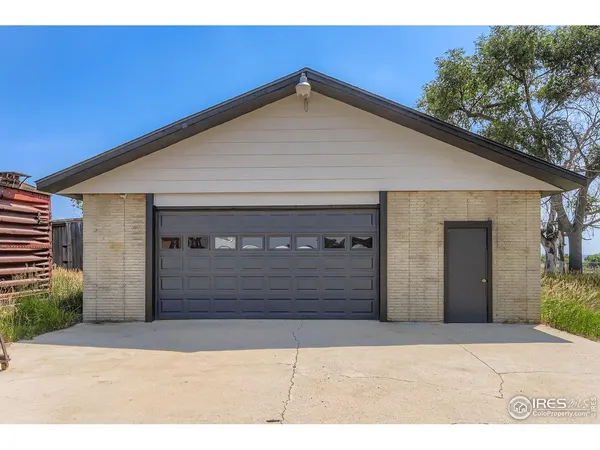 a front view of a house with a garage