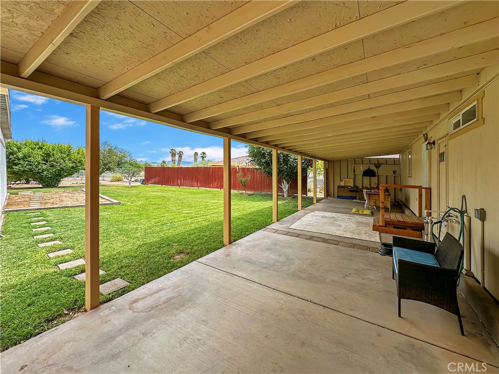 2224 Riviera Drive Blythe, CA 92225 - Photo 18 of 23 a view of a patio with table and chairs under an umbrella