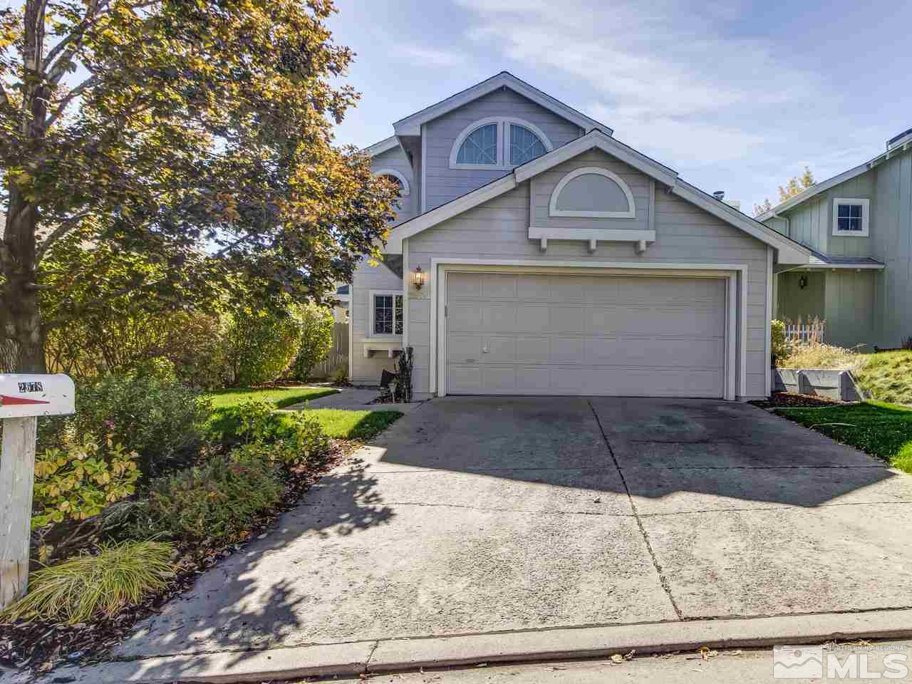 2678 Alpine Creek Road Reno, NV 89519 - Photo 1 of 25 a front view of a house with a yard and garage