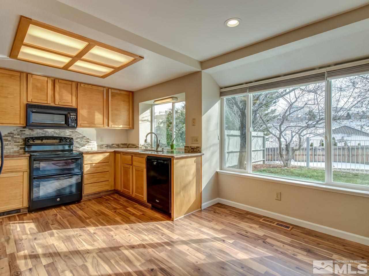 2678 Alpine Creek Road Reno, NV 89519 - Photo 11 of 25 a kitchen with a stove a sink and a microwave