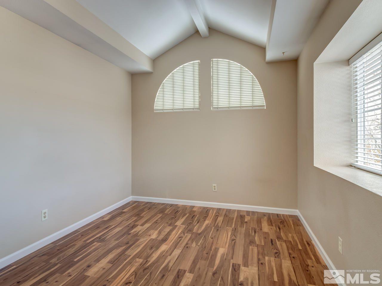 2678 Alpine Creek Road Reno, NV 89519 - Photo 17 of 25 an empty room with wooden floor and windows