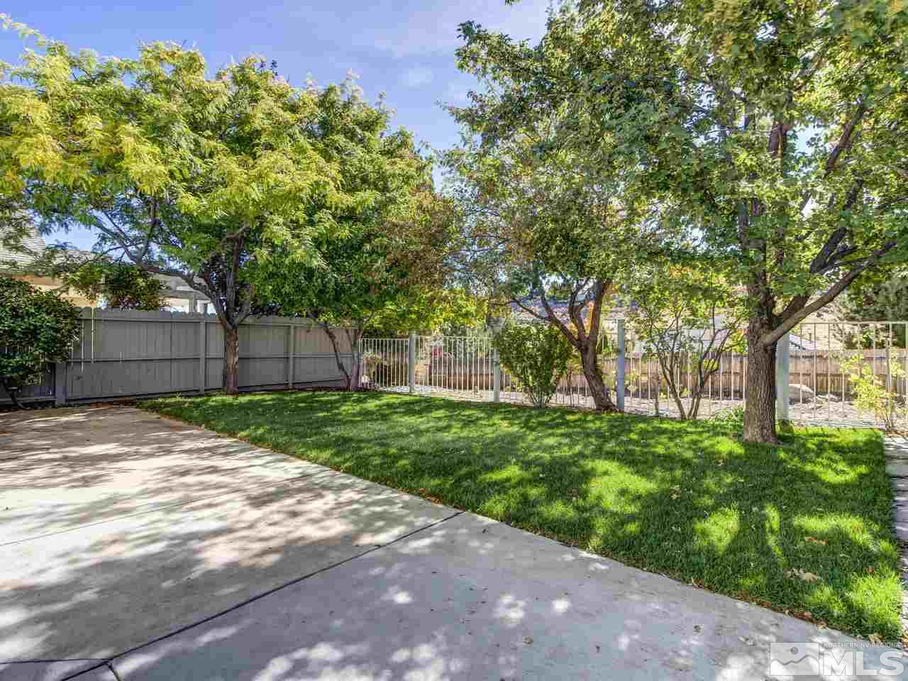 2678 Alpine Creek Road Reno, NV 89519 - Photo 20 of 25 a backyard of a house with lots of green space