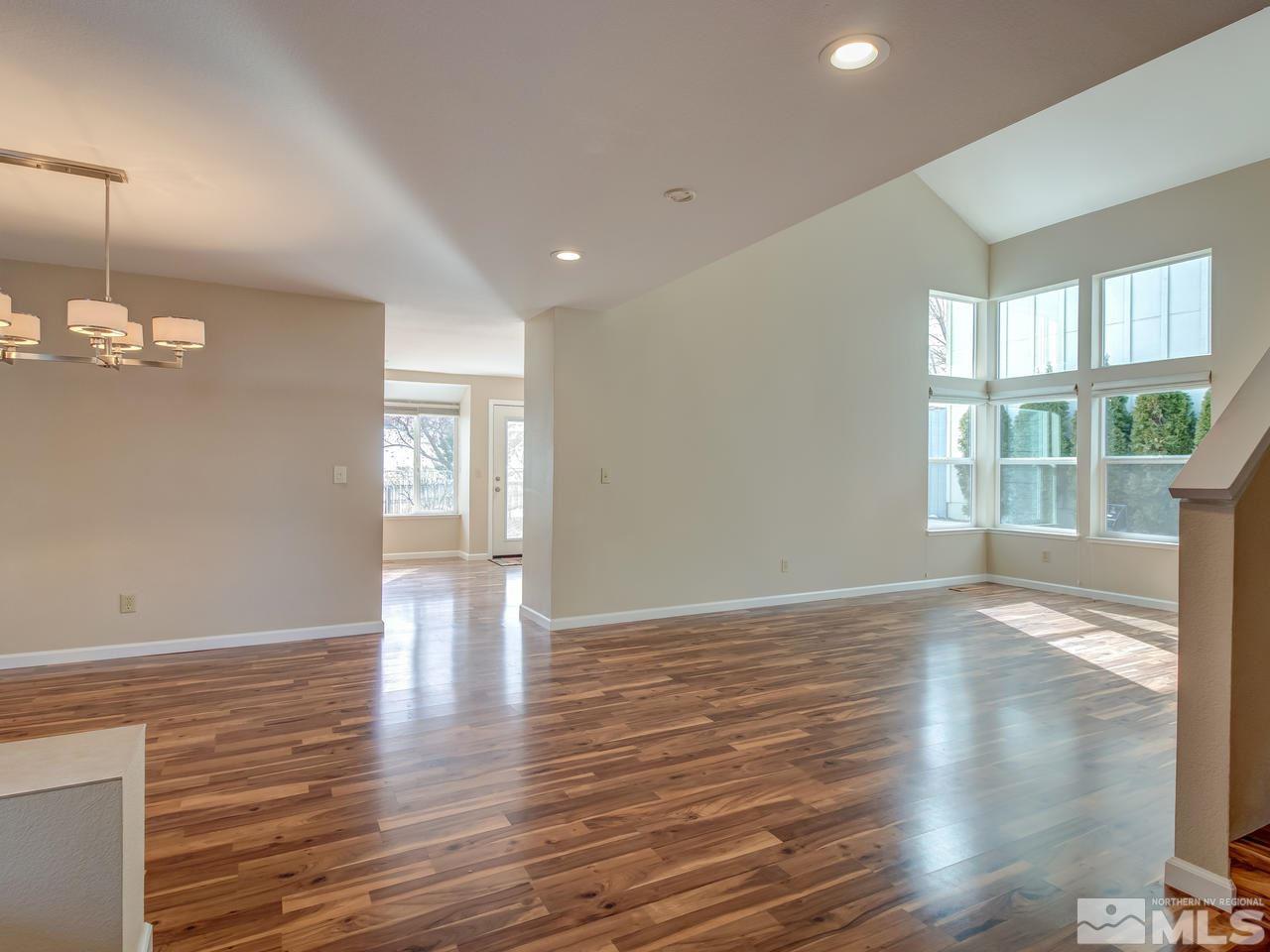 2678 Alpine Creek Road Reno, NV 89519 - Photo 3 of 25 a view of empty room with wooden floor and fan