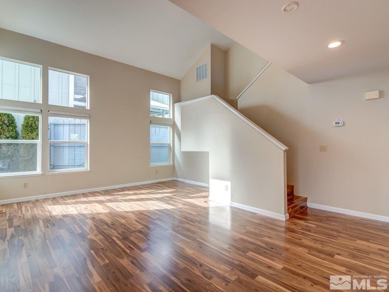 2678 Alpine Creek Road Reno, NV 89519 - Photo 5 of 25 a view of empty room with wooden floor and fan
