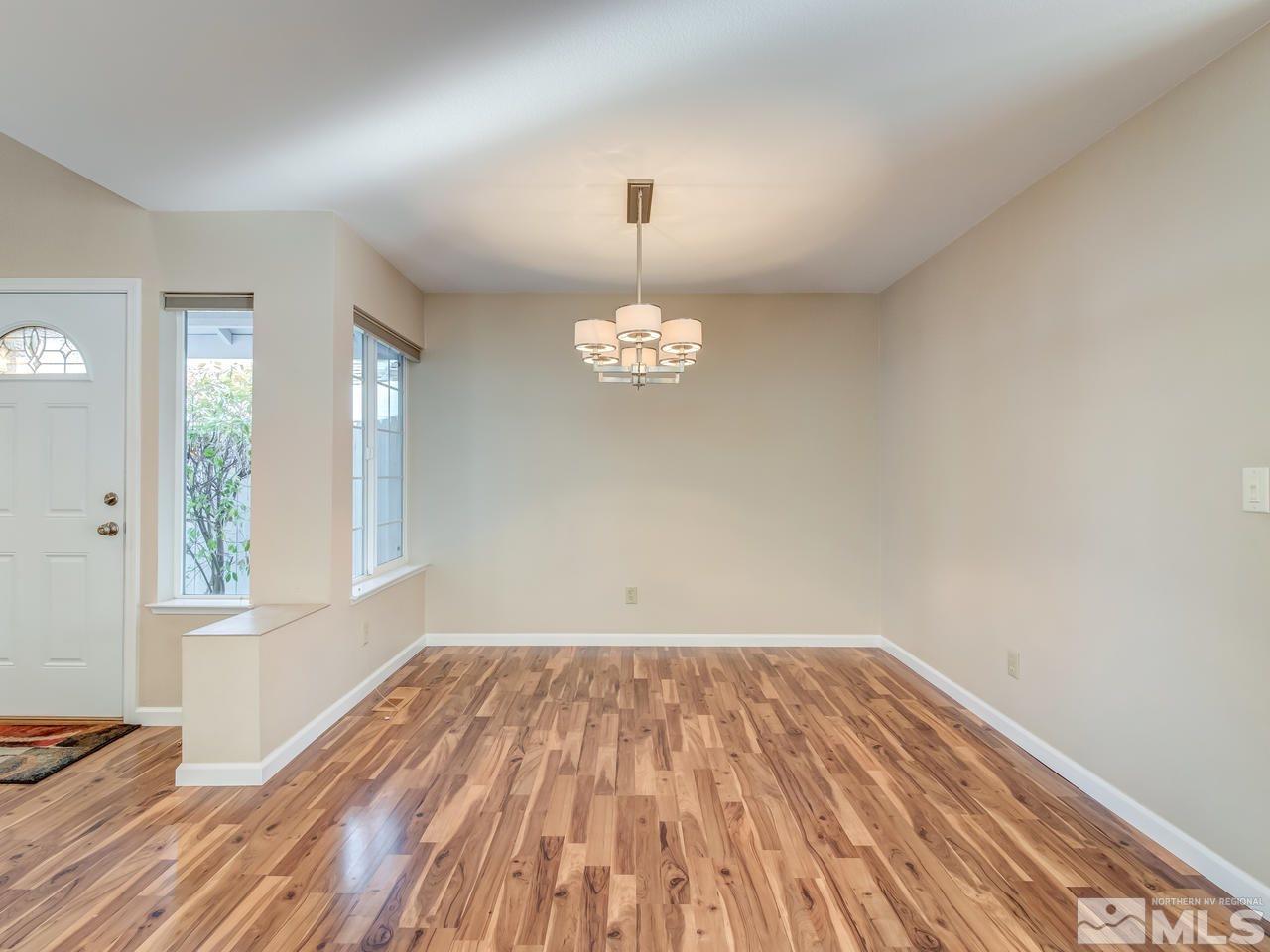 2678 Alpine Creek Road Reno, NV 89519 - Photo 6 of 25 a view of empty room with wooden floor and fan