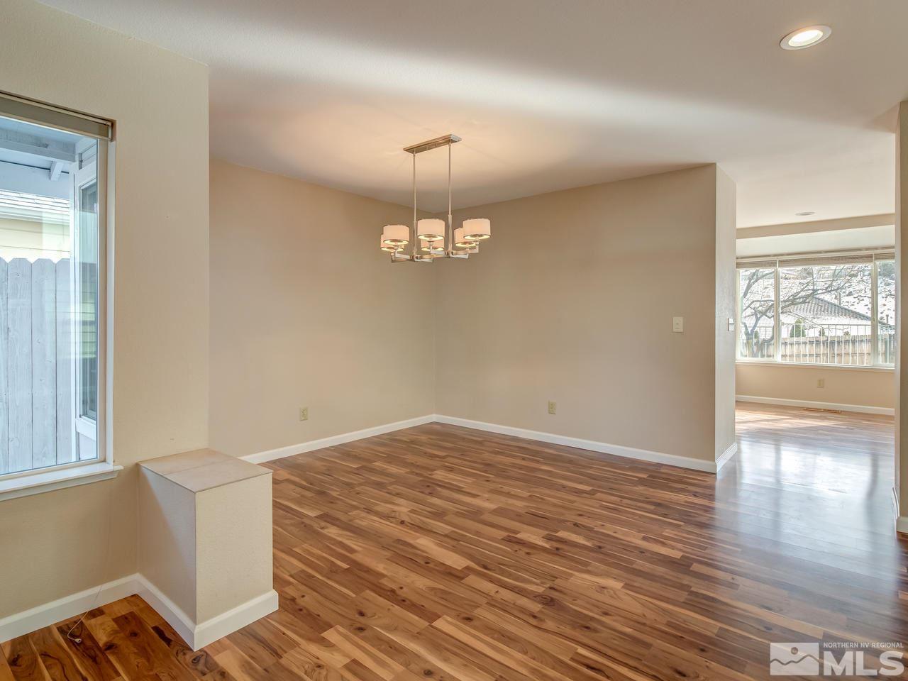 2678 Alpine Creek Road Reno, NV 89519 - Photo 7 of 25 wooden floor in an empty room with a window