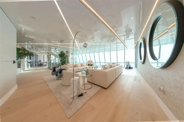 a dining room with furniture and a window
