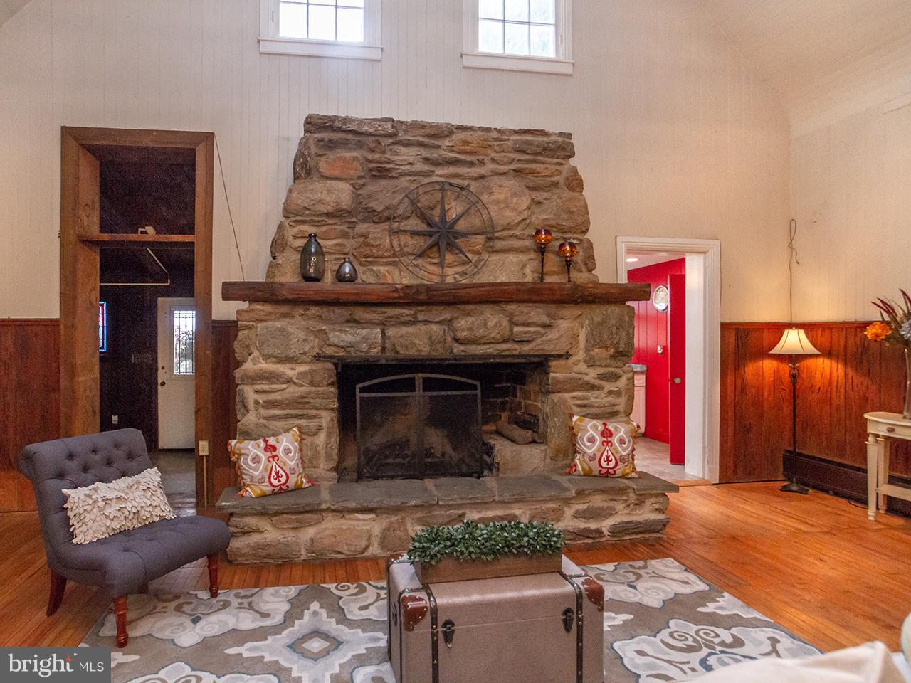 2504 West Ruhl Road Freeland, MD 21053 - Photo 14 of 43 a living room with furniture and a fireplace