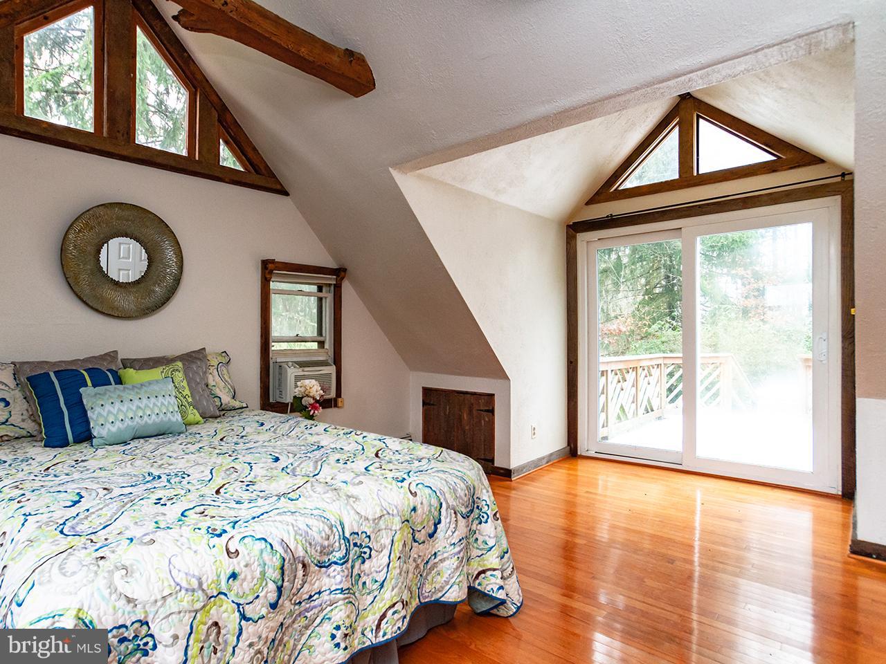 2504 West Ruhl Road Freeland, MD 21053 - Photo 20 of 43 a bedroom with a large bed and a large window