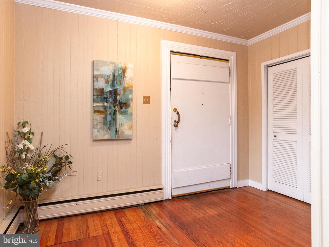 2504 West Ruhl Road Freeland, MD 21053 - Photo 9 of 43 an empty room with wooden floor and potted plant